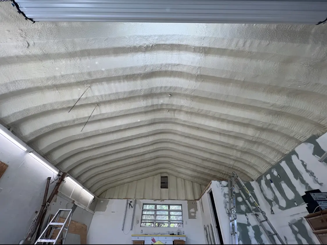 Spray polyurethane foam applied to the underside of a metal roof deck in Gladeview